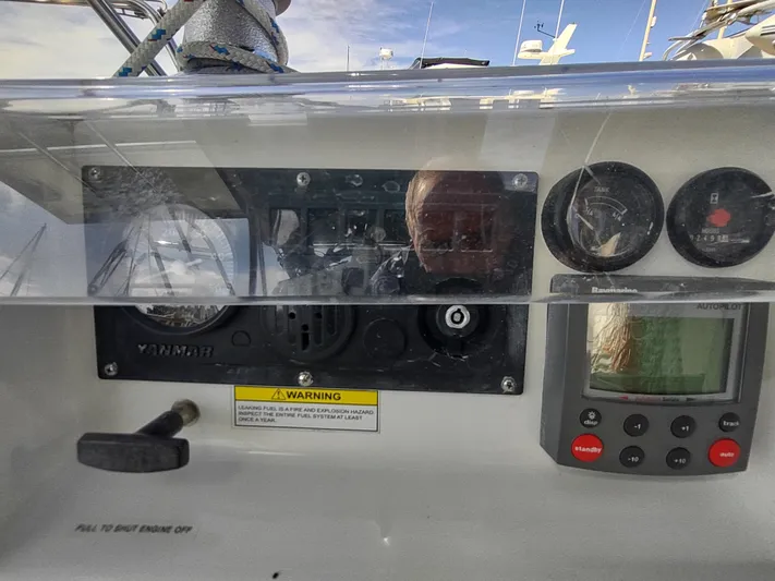 Rarebird Yacht Photos Pics Control panel of a 2004 Beneteau 393 sailboat with gauges and autopilot display.