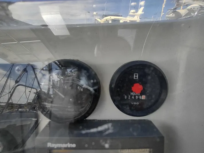 Rarebird Yacht Photos Pics Instrument panel of a 2004 Beneteau 393 sailboat, showing engine hours and gauges.
