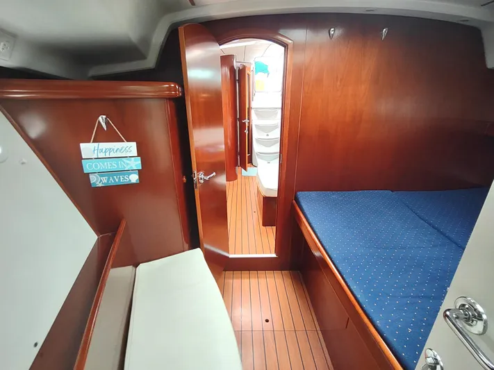 Rarebird Yacht Photos Pics Interior of 2004 Beneteau 393 yacht with wooden finish and cozy cabin.