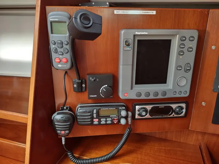 Rarebird Yacht Photos Pics Control panel of a 2004 Beneteau 393 sailboat with navigation and communication equipment.