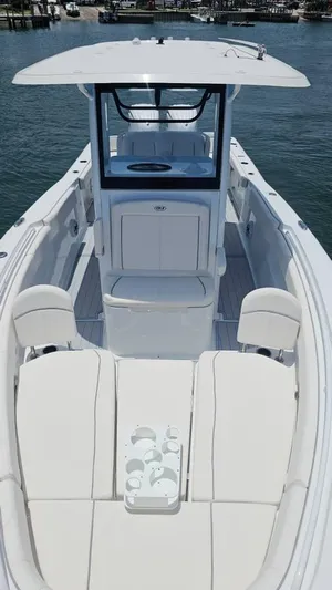  Yacht Photos Pics 2023 Sea Hunt Ultra 305 SE boat with spacious seating and sleek design on the water.