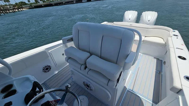  Yacht Photos Pics 2023 Sea Hunt Ultra 305 SE boat interior with plush seating and dual engines.
