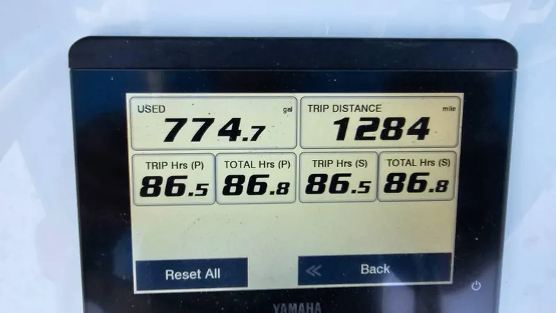  Yacht Photos Pics Display screen showing fuel usage, trip distance, and engine hours for 2023 Sea Hunt Ultra 305 SE.