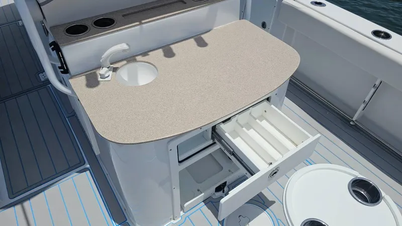  Yacht Photos Pics 2023 Sea Hunt Ultra 305 SE boat with open storage drawer and sink on deck.