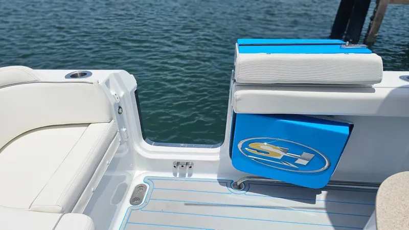  Yacht Photos Pics 2023 Sea Hunt Ultra 305 SE boat interior with seating and storage, on water.