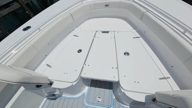  Yacht Photos Pics 2023 Sea Hunt Ultra 305 SE boat interior with white seating and deck.