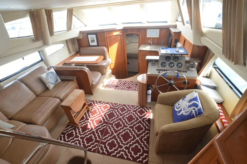 The Loon Yacht Photos Pics Interior of 2004 Carver 366 Motoryacht with cozy seating and nautical decor.