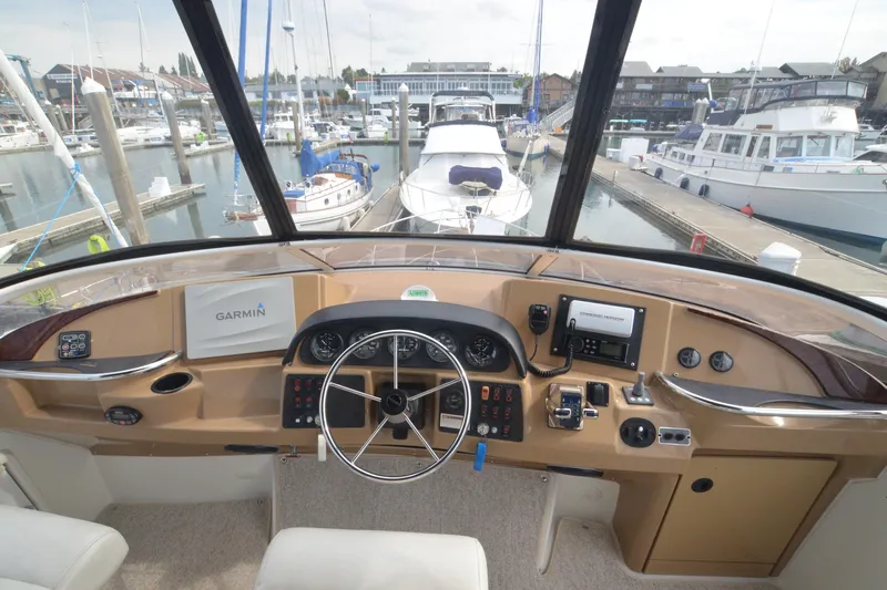 The Loon Yacht Photos Pics Helm of 2004 Carver 366 Motoryacht with Garmin navigation, docked in marina.