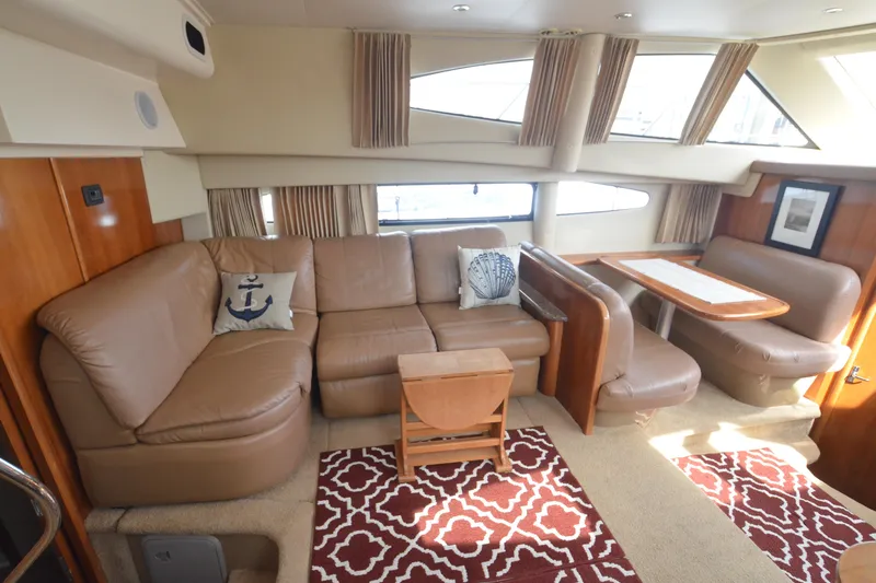 The Loon Yacht Photos Pics Luxurious interior of 2004 Carver 366 Motoryacht with leather seating and dining area.
