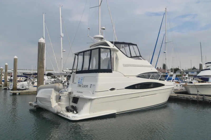 The Loon Yacht Photos Pics 2004 Carver 366 Motoryacht docked at marina, featuring sleek design and spacious deck.