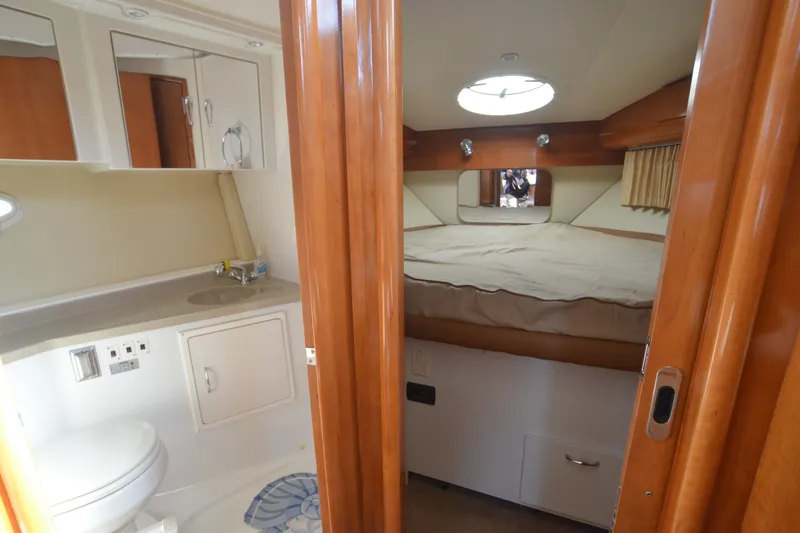 The Loon Yacht Photos Pics 2004 Carver 366 Motoryacht interior with cozy bedroom and compact bathroom.