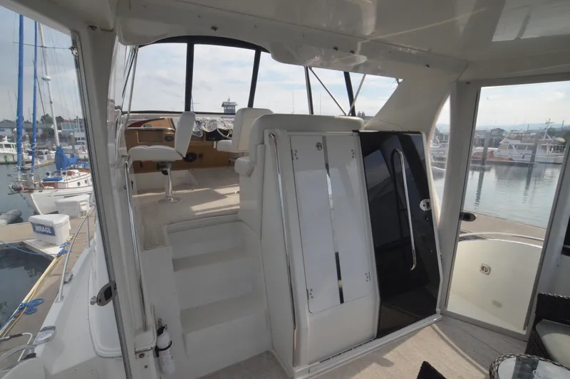 The Loon Yacht Photos Pics 2004 Carver 366 Motoryacht interior with helm, marina view, and modern design.