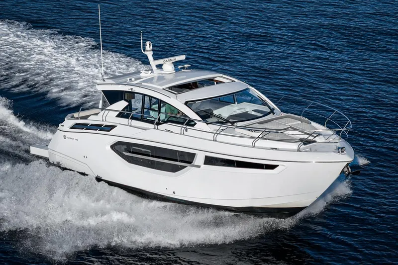 Lagniappe Yacht Photos Pics 2023 Cruisers Yachts 42 Cantius cruising on open water, showcasing sleek design and luxury.