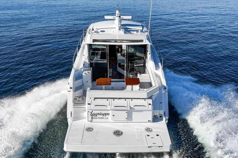 Lagniappe Yacht Photos Pics 2023 Cruisers Yachts 42 Cantius cruising on open water, rear view.