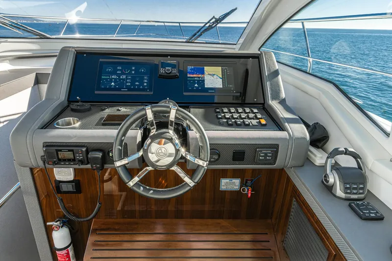Lagniappe Yacht Photos Pics Helm of 2023 Cruisers Yachts 42 Cantius with advanced navigation displays and controls.