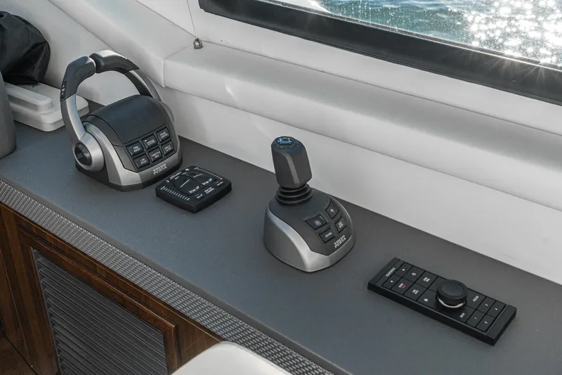 Lagniappe Yacht Photos Pics Control panel of 2023 Cruisers Yachts 42 Cantius with joystick and throttle controls.