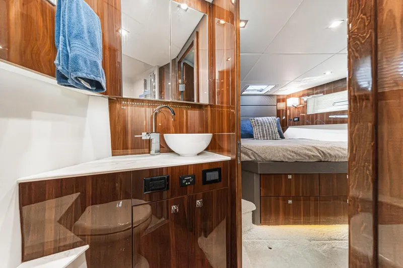 Lagniappe Yacht Photos Pics Luxurious 2023 Cruisers Yachts 42 Cantius interior with elegant wood finish and modern amenities.