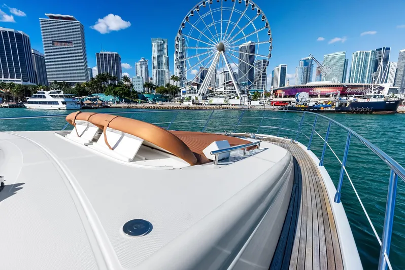  Yacht Photos Pics Azimut 72S yacht in city harbor with Ferris wheel and skyline, 2014 model.