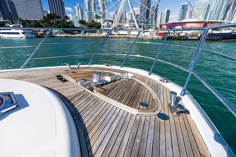  Yacht Photos Pics Azimut 72S yacht deck with city skyline and Ferris wheel in the background.