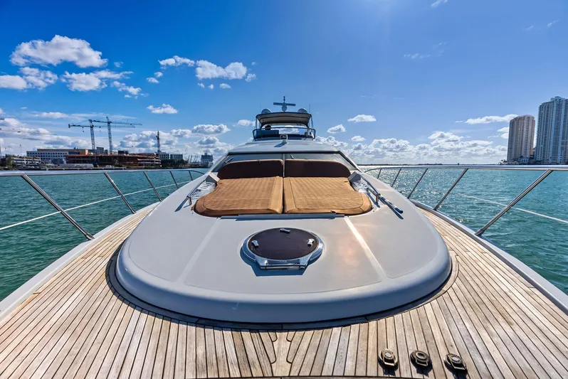  Yacht Photos Pics Luxurious 2014 Azimut 72S yacht deck with sunbeds, ocean view, and city skyline.
