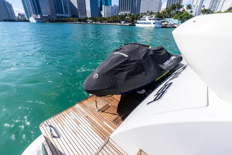  Yacht Photos Pics Azimut 72S yacht with jet ski on deck, city skyline in background, 2014 model.