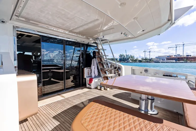  Yacht Photos Pics Luxurious 2014 Azimut 72S yacht deck with seating, table, and ocean view.