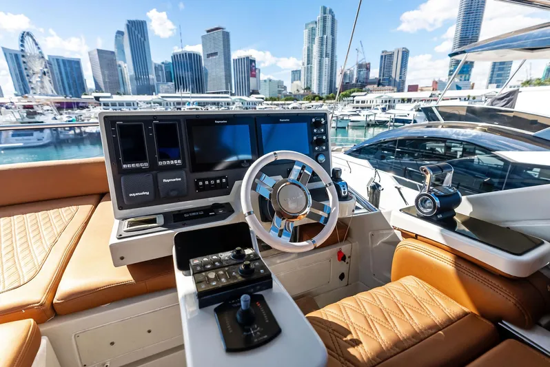  Yacht Photos Pics Luxurious 2014 Azimut 72S yacht helm with city skyline view.