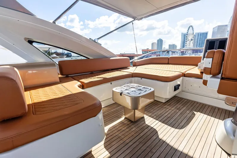  Yacht Photos Pics Luxurious 2014 Azimut 72S yacht deck with plush seating and city skyline view.