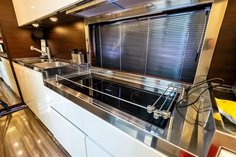  Yacht Photos Pics Modern kitchen interior on 2014 Azimut 72S yacht with sleek appliances and glossy finishes.