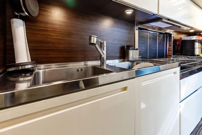  Yacht Photos Pics Modern kitchen interior of 2014 Azimut 72S yacht with sleek stainless steel sink.