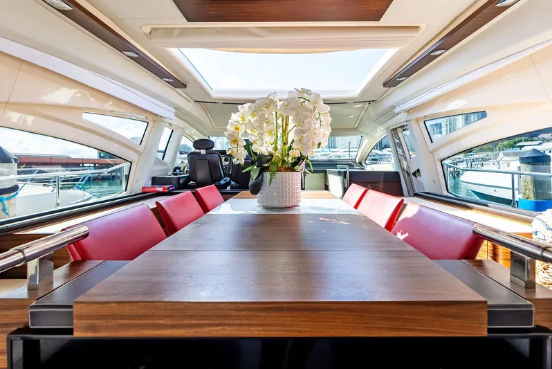  Yacht Photos Pics Luxurious interior of 2014 Azimut 72S yacht with elegant dining area and floral centerpiece.