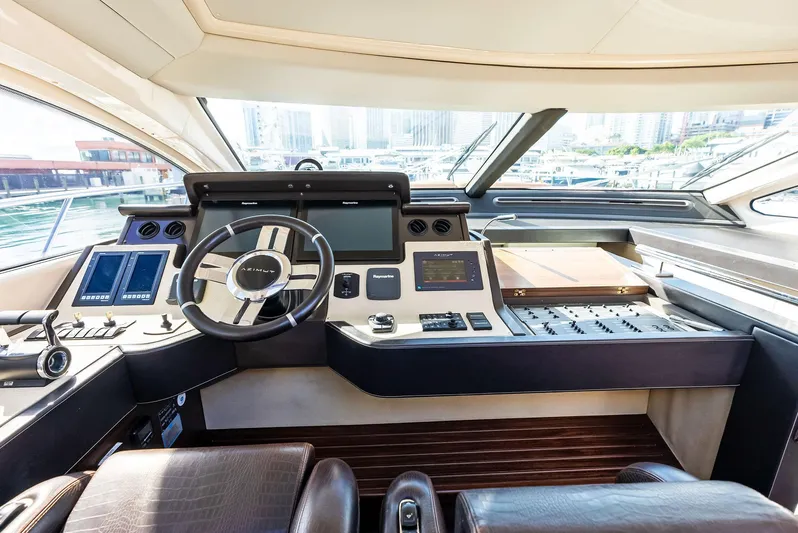  Yacht Photos Pics Luxurious 2014 Azimut 72S yacht cockpit with modern navigation controls and leather seating.