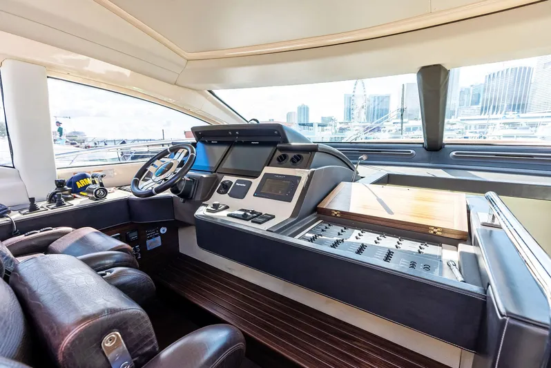  Yacht Photos Pics Luxurious 2014 Azimut 72S yacht cockpit with modern controls and city skyline view.