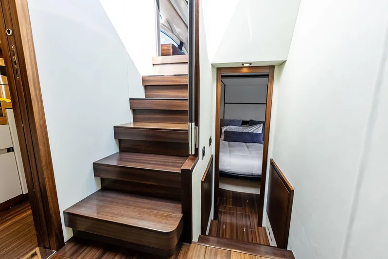  Yacht Photos Pics Interior of 2014 Azimut 72S yacht with wooden stairs and cozy cabin entrance.