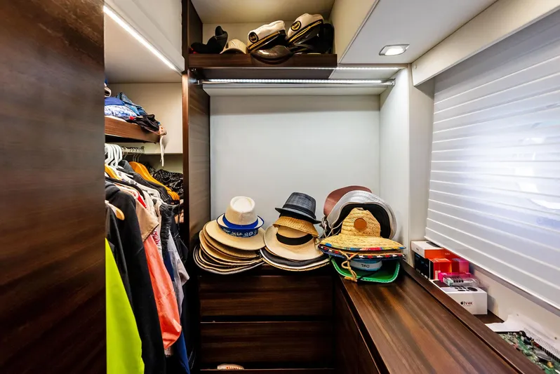  Yacht Photos Pics Luxurious Azimut 72S yacht closet with hats and clothing, 2014 model.