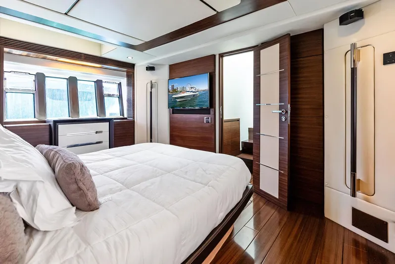  Yacht Photos Pics Luxurious bedroom interior of 2014 Azimut 72S yacht with modern design and wood accents.