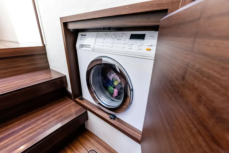  Yacht Photos Pics Built-in washing machine on 2014 Azimut 72S yacht, wooden interior.
