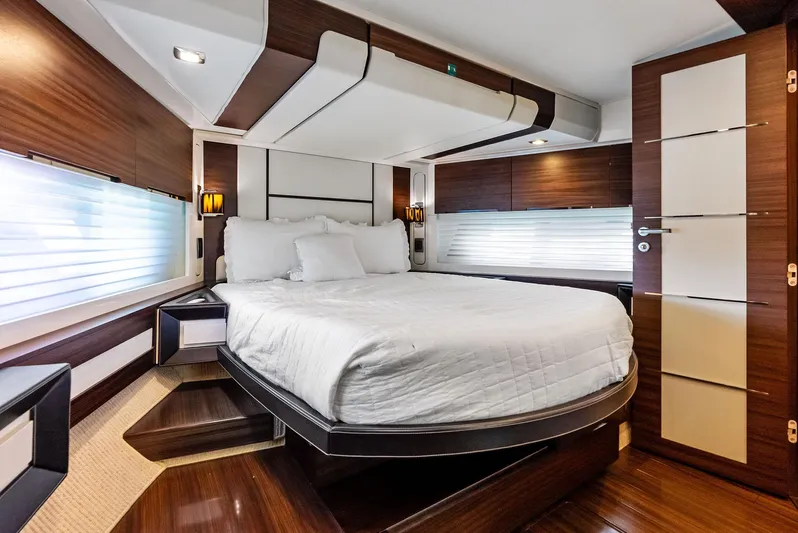  Yacht Photos Pics Luxurious bedroom interior of 2014 Azimut 72S yacht with modern design and cozy ambiance.