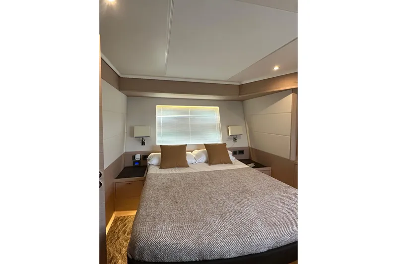 Gran Firin Yacht Photos Pics Luxurious bedroom interior of 2024 Beneteau Grand Trawler 62 yacht.