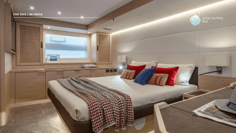 Gran Firin Yacht Photos Pics Luxurious bedroom interior of 2024 Beneteau Grand Trawler 62 yacht, featuring modern design and cozy decor.