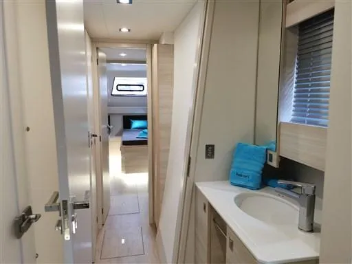  Yacht Photos Pics Interior of 2019 Catana 53 yacht featuring modern bathroom and cozy bedroom.