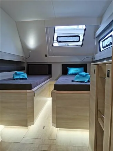  Yacht Photos Pics Interior of 2019 Catana 53 yacht cabin with twin beds and modern design.