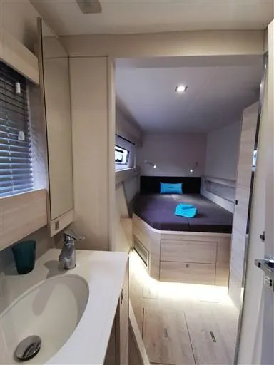  Yacht Photos Pics Interior of 2019 Catana 53 yacht featuring a modern bedroom and bathroom.