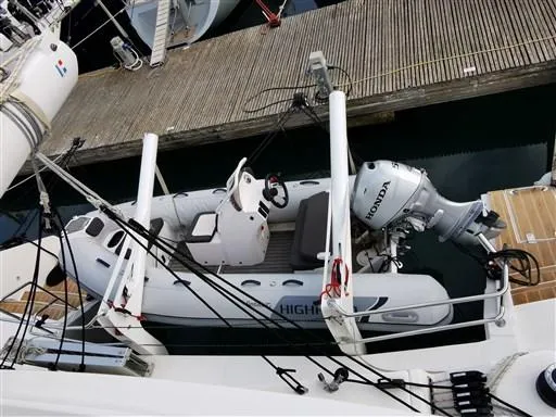  Yacht Photos Pics 2019 Catana 53 yacht with a Honda outboard motor and inflatable boat docked.