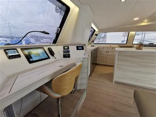  Yacht Photos Pics Interior of 2019 Catana 53 yacht with modern navigation station and sleek design.