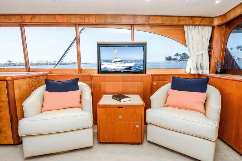 Shotgun Yacht Photos Pics Luxurious 1981 Merritt 55 c yacht interior with plush seating and ocean view.