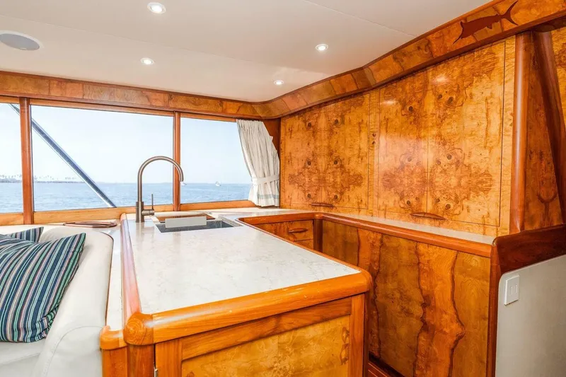 Shotgun Yacht Photos Pics Luxurious wooden interior of 1981 Merritt 55 c yacht with ocean view.