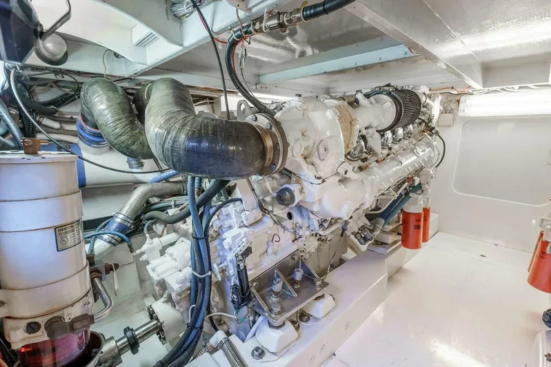 Shotgun Yacht Photos Pics Engine room of a 1981 Merritt 55 c yacht, showcasing a powerful marine engine.