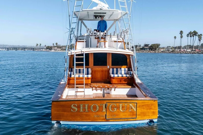 Shotgun Yacht Photos Pics 1981 Merritt 55 c yacht "Shotgun" on calm water, San Diego backdrop.
