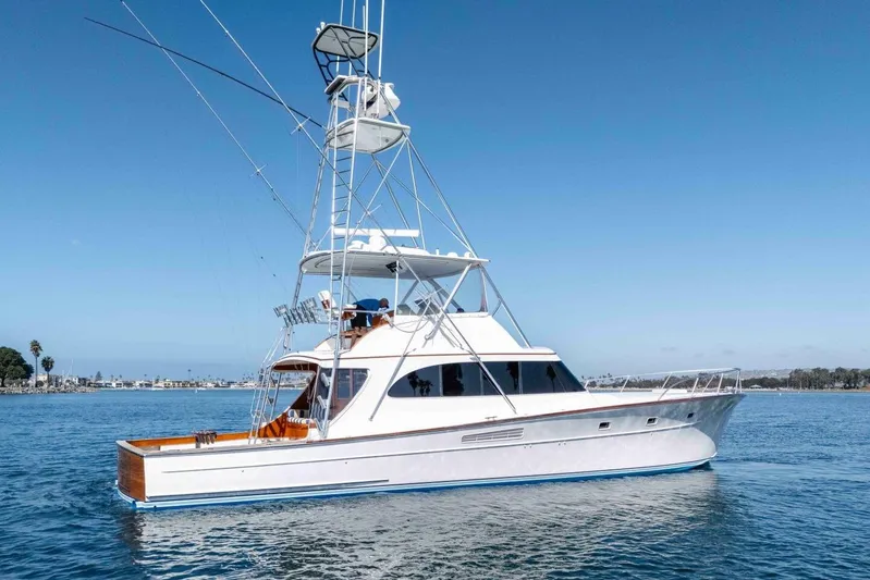 Shotgun Yacht Photos Pics 1981 Merritt 55 c yacht on calm blue water under clear sky.